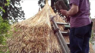 Thatching a round straw roof iron age hut thatch style [upl. by Cir]