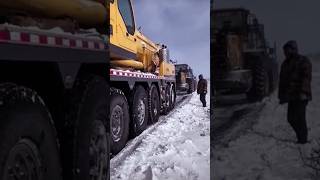 The process of towing a hightonnage crane on a snowy road [upl. by Borden]