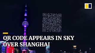 Scannable QR code appears in sky above China’s Shanghai [upl. by Novaelc]