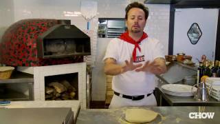 How to Stretch Pizza Dough  CHOW Tip [upl. by Omarr139]