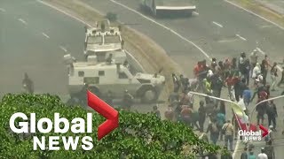 Venezuela Military vehicle seen running over protesters in Caracas [upl. by Gibbs]