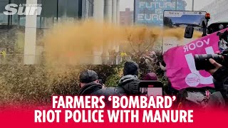 Protesting farmers bombard riot police with manure as they clash in Brussels [upl. by Khajeh]