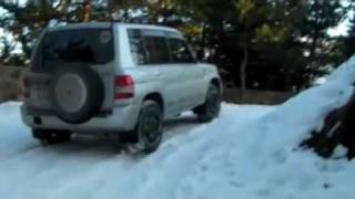 pajero io in wet snowmp4 [upl. by Nalon995]