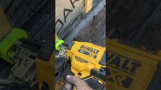 Cordless Dewalt nailer with the drywall siding tip Installing versetta stone [upl. by Eedissac]