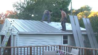 Roof Work Part 4 Installing Panels on Garage Roof [upl. by Amsirac]