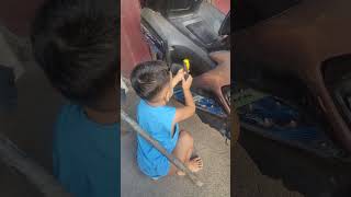 Toddler fixing motorcycle aerox [upl. by Schechinger]