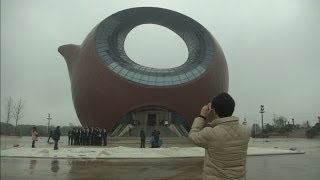 Giant teapotshaped building to open in China [upl. by Thorr906]