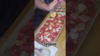 carpaccio is a dish served raw with oliveoil lemon parmigianoreggiano olioextravergine limone [upl. by Ayom]