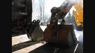 John Deere 110 TLB Backhoe bucket change [upl. by Ennaeirb115]