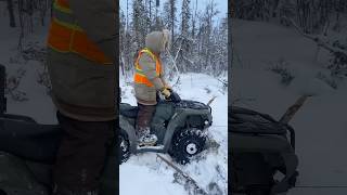 Winching frozen snowmobile with quad [upl. by Inohtna]