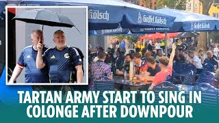 The Tartan Army start to sing in Cologne after earlier heavy rain downpour [upl. by Namlaz]