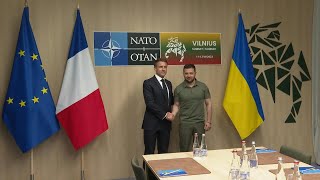 Frances Macron and Ukraines Zelensky arrive for a bilateral meeting at NATO Summit  AFP [upl. by Ecilayram]