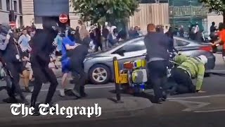 Liverpool clashes Police officer pushed off motorbike and attacked by farRight rioters [upl. by Columbine]