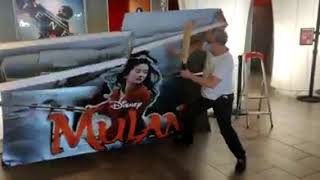 Theater worker destroys Mulan display after Disney announces its going straight to streaming [upl. by Beedon96]