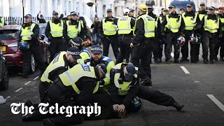 ProPalestine rally FarRight clash with police as 100 counterprotesters arrested [upl. by Ellecram]