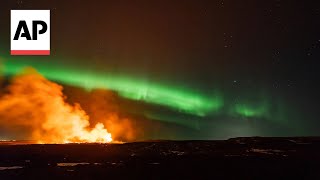 Iceland volcano erupts amidst Northern Lights display  AP EXCLUSIVE [upl. by Mudenihc]