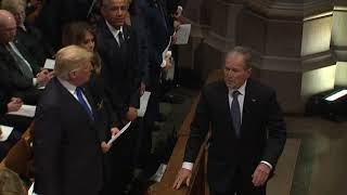 George W Bush sneaks candy to Michelle Obama at Bush funeral [upl. by Sew]