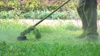 worker cutting grass in garden with the weed trimmer grass cutter in action cl SBV 323907303 preview [upl. by Anatlus]