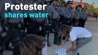 See protesters donating water to police and thanking them [upl. by Ivy20]