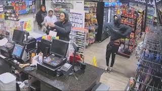 Clerk bombarded by 4 gunmen during robbery at SW Houston gas station video shows [upl. by Vezza630]