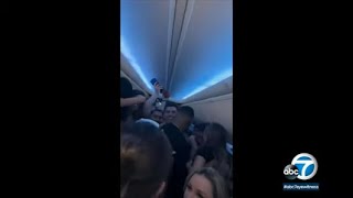 Sunwing party flight video Canadians stuck in Cancun after drinking vaping maskless aboard plane [upl. by Coray107]