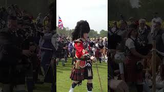 Massed Pipes and Drums continuing their morning parade during 2022 Gordon Castle Games shorts [upl. by Assirhc241]