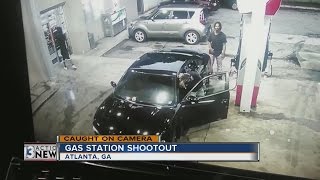 A gas station shootout in Atlanta caught on camera [upl. by Yrogreg584]