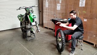 How to replace a Kawasaki KX450F front wheel [upl. by Carmela]