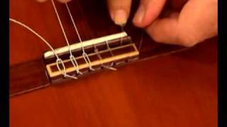 How to change classic guitar strings [upl. by Niletak]