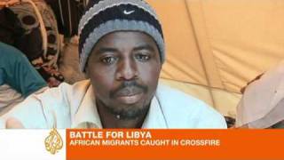 Migrants caught in Libya crossfire [upl. by Ruff]