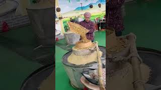 The process of grinding grains into powder with stone mills [upl. by Nan]