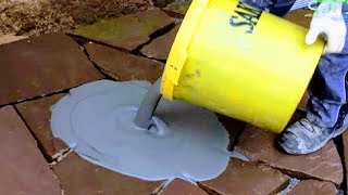 HOW TO LAYGROUT FLAGSTONE SLABS  PRO GROUTING NATURAL STONE SAND JOINTS MASONRY PATIO PAVERS WORK [upl. by Tamarah110]