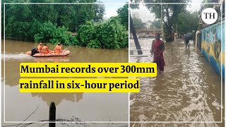 Mumbai rains Heavy rain lashes Mumbai train services affected [upl. by Kendall]