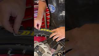 Dunlop Tire Sticker Install motocross dirtbike techtips [upl. by Neehs]