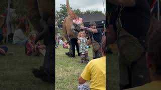 Brave kid celebrates escaping the raptor dinomania dinosaur utahraptor glastonbury raptor [upl. by Nations513]