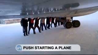 Push Starting a Plane Russian passengers push plane at Igarka airport [upl. by Dranoel209]