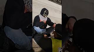 Police Try to Remove Masked Man Palestinian Supporter Before Million Mask March [upl. by Eilyk98]