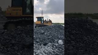 Bulldozers action pushing rock on construction [upl. by Adyan211]