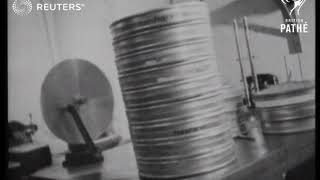 UK USA  Scenes in British Paramount news cutting room showing moviolas at work  Scenes 1941 [upl. by Mellicent10]