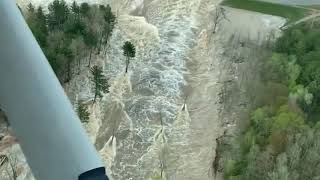 Pilot captures rushing water flowing through failed Edenville Dam [upl. by Hailahk]