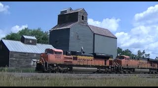 BNSF SD70ACe leads westbound coal racing past the old elevator at Eldridge ND [upl. by Angelica]