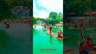 The process of boatmen rowing bamboo rafts for drifting on the Yulong River [upl. by Ramonda]