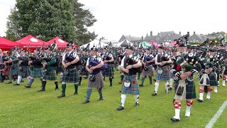 Massed Pipe Bands Salute Chieftain on the march during opening parade 2022 Dufftown Highland Games [upl. by Krenn]