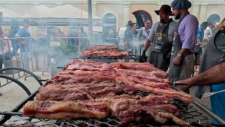 Churrasco gaúcho na rua 500 kg de costela 300 kg de linguiça ovelha na estaca e paella campeira [upl. by Atsirhc917]