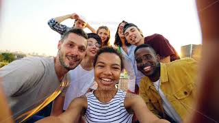 Point of view shot of African American girl holding camera and taking selfie with happy friends at [upl. by Baudelaire]