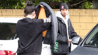 Kylie Jenner Tries To Hide Her MakeupFree Face On Lunch Date With Tyga [upl. by Henryk213]