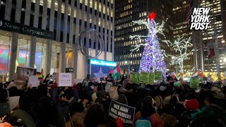 ProPalestinian protesters swarm Midtown in bid to derail Rockefeller Center Christmas tree lighting [upl. by Hardan]