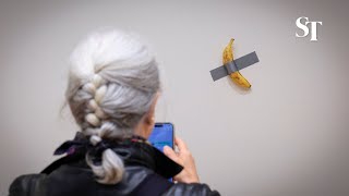 Ducttaped banana sells for US6 million at Sothebys [upl. by Iliak]