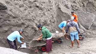 The process of separating stone and black sand is carried out by manual sand miners [upl. by Chappelka]