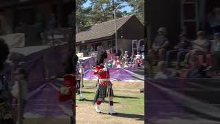 Massed Pipe Bands led by Drum Majors arrive at the 2022 Ballater Highland Games in Scotland shorts [upl. by Naihr140]